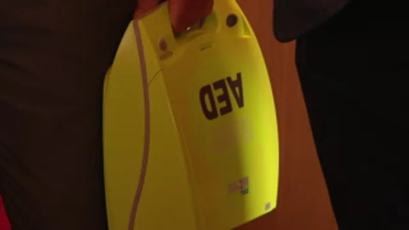 WVU donates defibrillator to parish to help respond to cardiac emergencies