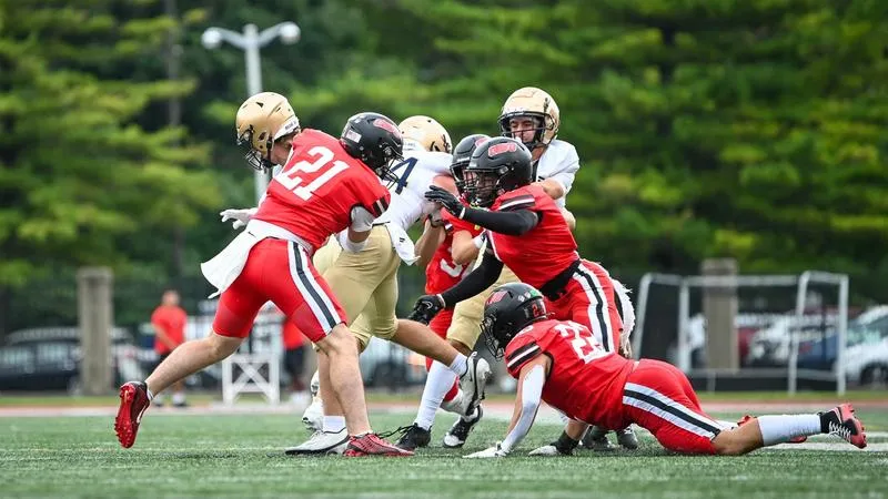 Football Falls to No. 9 John Carroll on Community Day