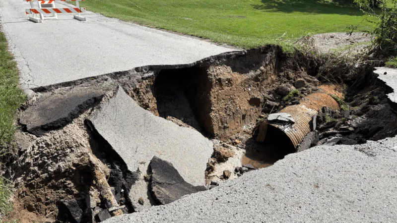 Floodwaters in Greenfield culvert sweep firefighter 179 feet during debris cleanup