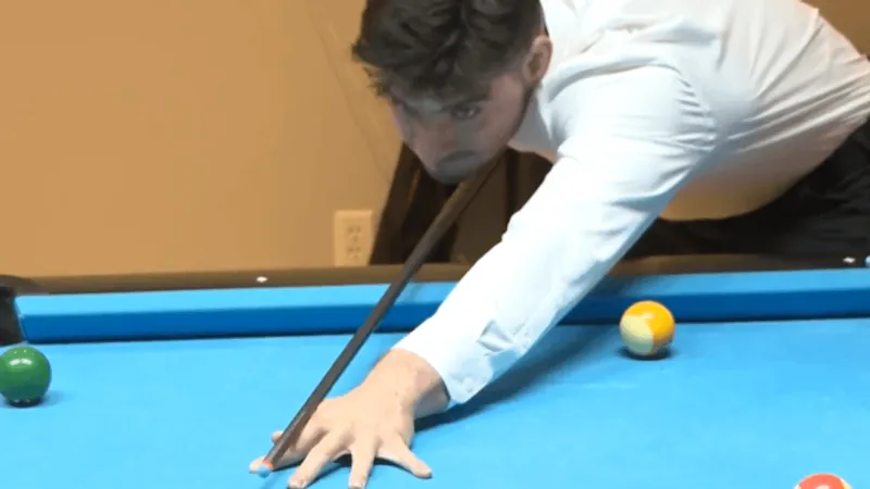 Pool trick shot artist Mihellis sets Guinness record with 23-inch one-handed jump pot