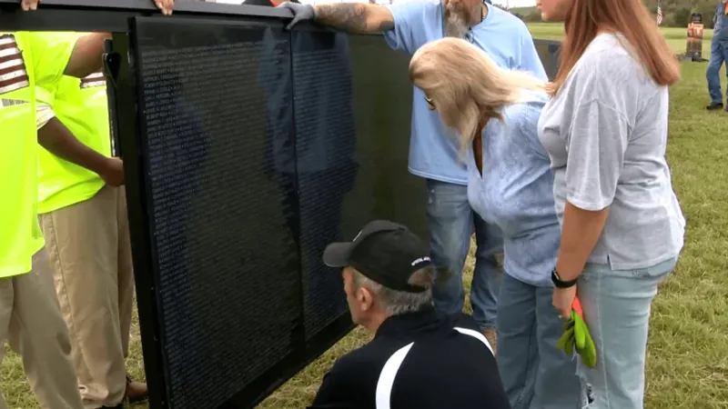 Family helps install The Wall That Heals, evoking remembrances