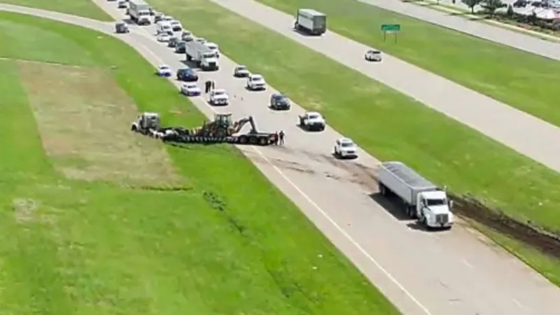 Semi crosses Highway 169 median, crashes into ditch after tire blow out