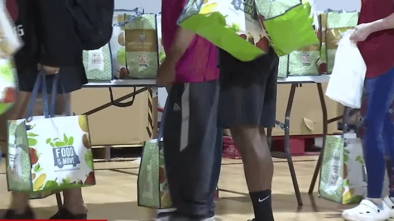 Hundreds line up in northwest Tulsa for free groceries as inflation strains budgets