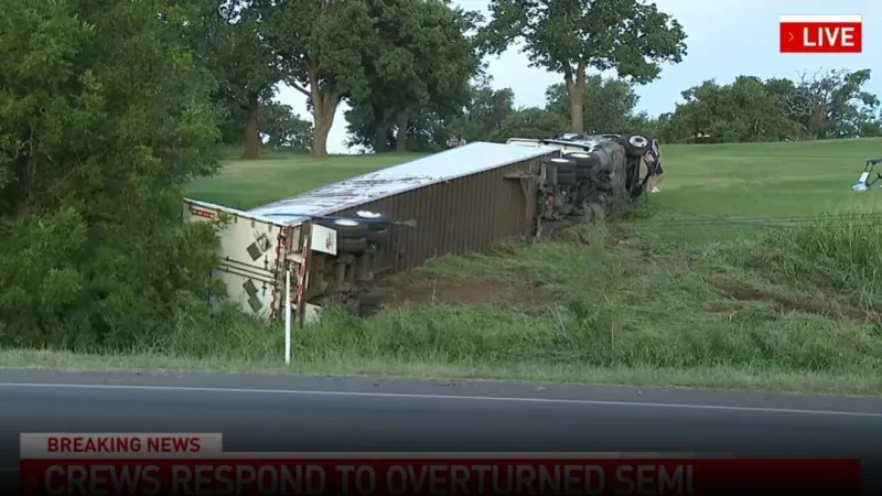 Semi-truck overturns on golf course along I-35