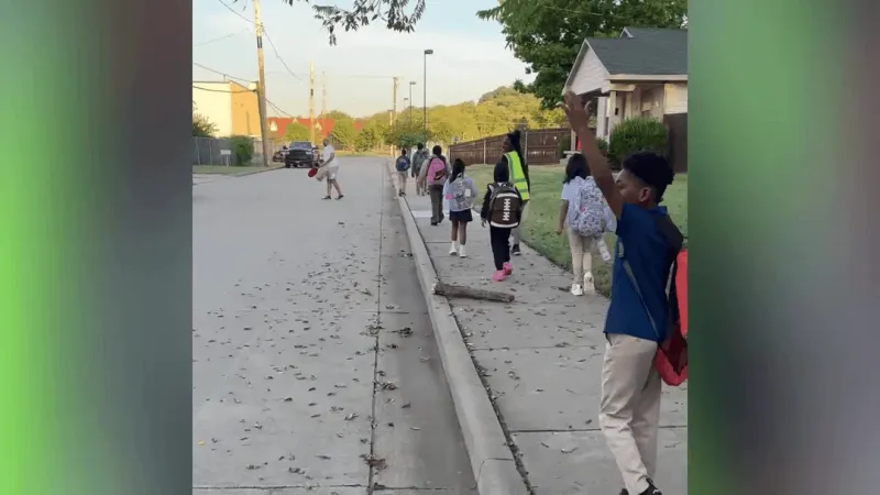 North Tulsa walking school bus aims to curb absences as kids face unsafe route to class