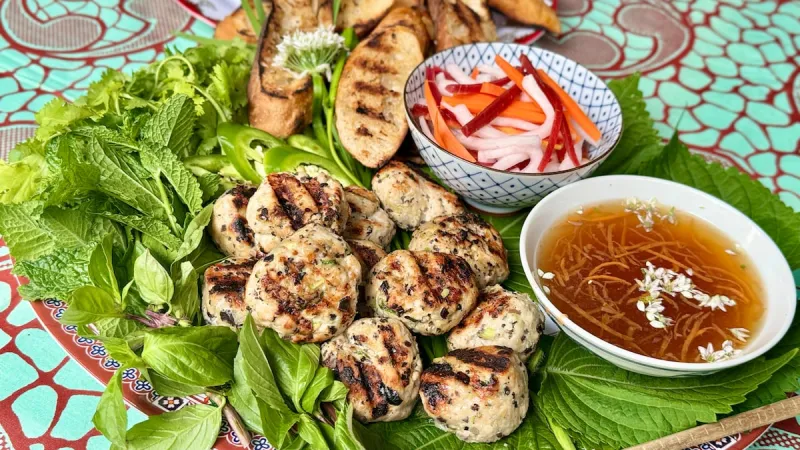 Superabundant recipe: Grilled lemongrass chicken meatballs and buttery baguette with gobs of Vietnamese herbs