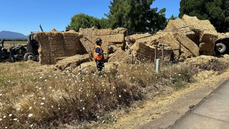 Hwy 99W south of Corvallis closed after semi overturns, spills hay bales