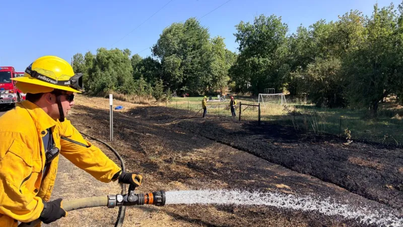 Fast moving fire stopped along Highway 34