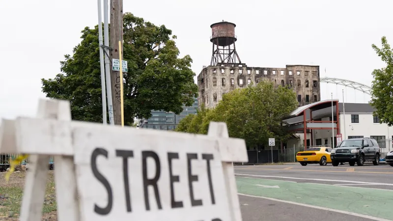 Portlanders gather to remember Centennial Mills as demolition gets off to slow, quiet start
