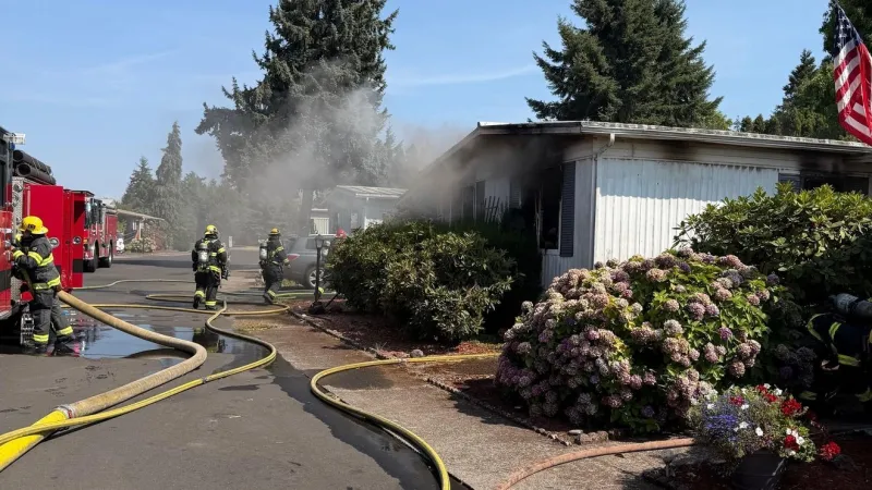 Double-wide mobile home fire near RiverBend contained before it spread