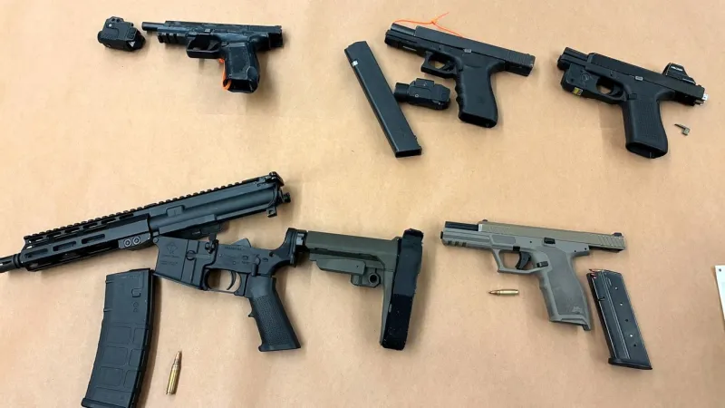 Three arrested after Buckman Tesla crash and hourslong search; five guns seized