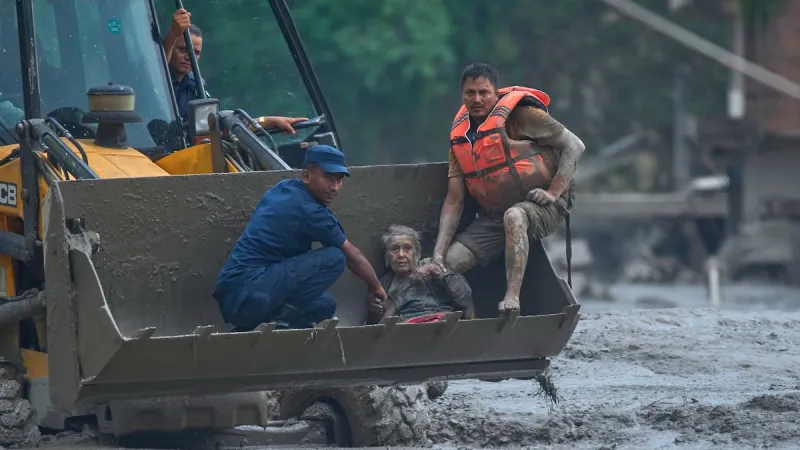 At least 75 killed and hundreds missing after flash floods in Nepal and China