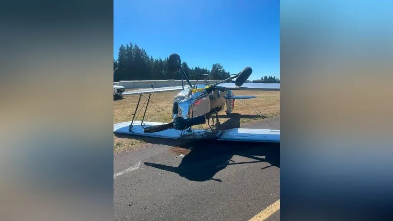 Biplane flips on landing after pilot reports smoke in cabin at Grove Field