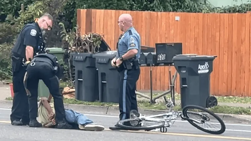 Bicyclist arrested on disorderly conduct after driving in front of fire truck