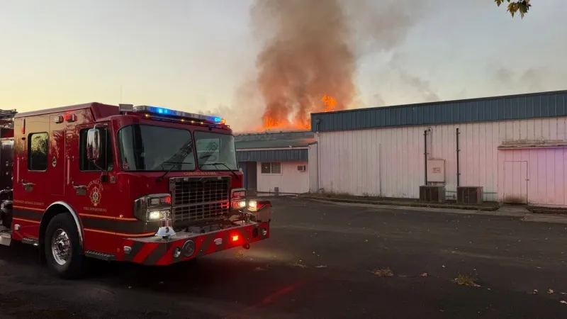 Firefighters battle 2-alarm fire at building south of Cornelius
