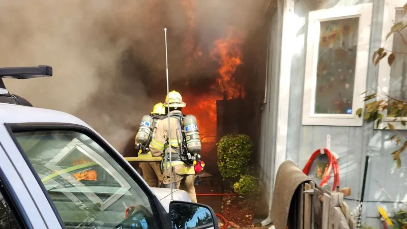 Firefighters battle garage fire that spread into Lebanon home