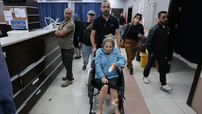 Israeli settlers beat Palestinians and a U.S. photojournalist in West Bank attacks