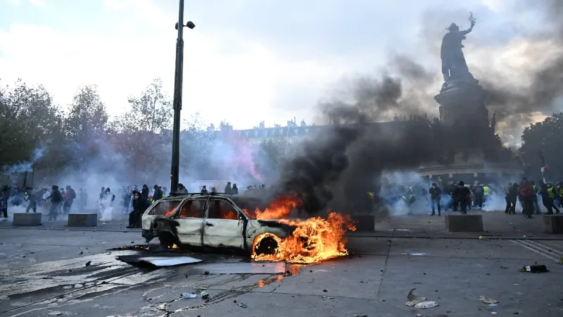 Scuffles and fires break out as protesters rally across France, joining students