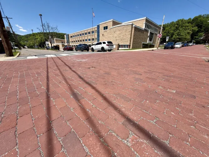 Council votes to pave two brick street sections