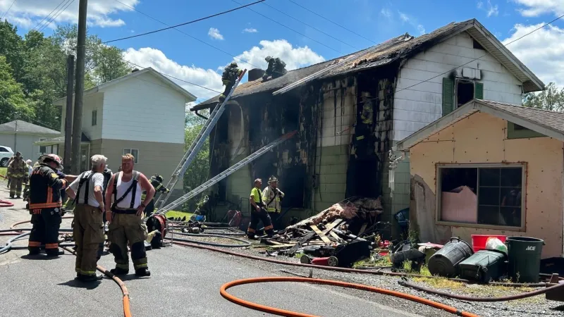 Person rescued off roof of burning building in Brookville, deputy chief says