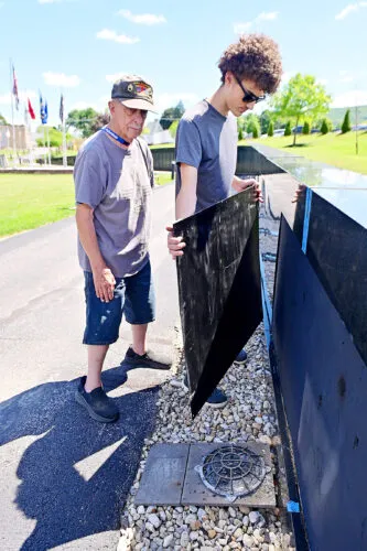 Healing the Wall: Volunteers restore local memorial to those lost in Vietnam War