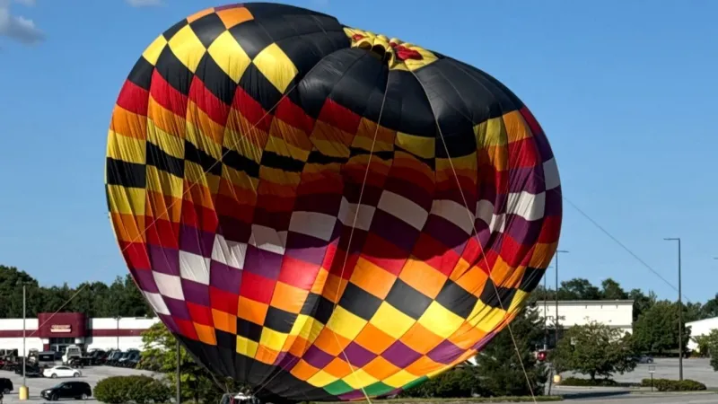 Witnesses: Man reportedly hurt when hot air balloon goes awry at local carnival