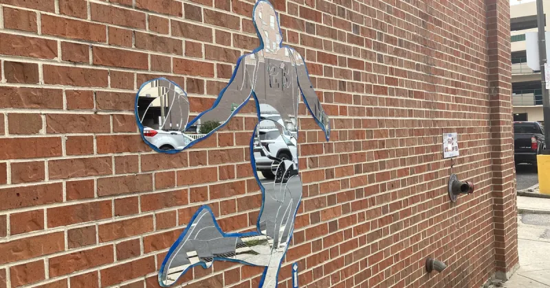 Street artist 'irregular' installs LeBron James-shaped mirror on Center City wall