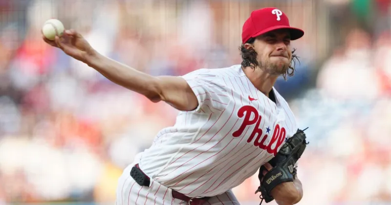 Phillies' Aaron Nola reaches 2,000 strikeouts before leaving with leg injury in loss to Blue Jays