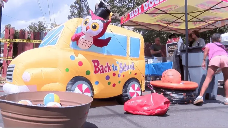 Local barbershop holds back-to-school block party for children