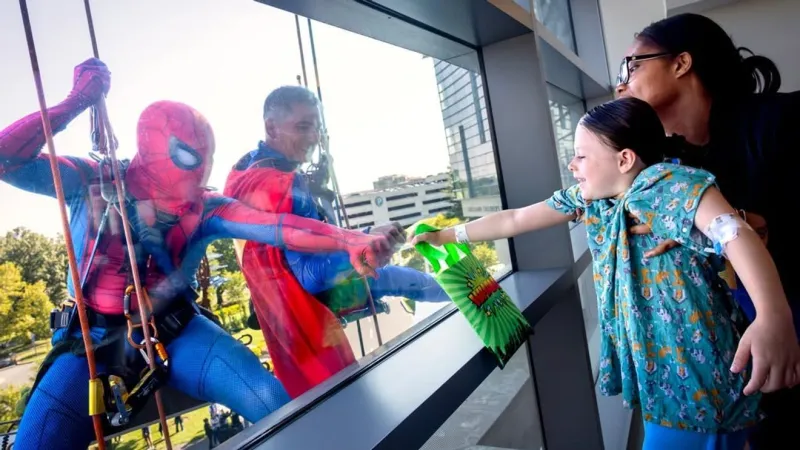 Superheroes propel down Penn State Children's Hospital during annual visit