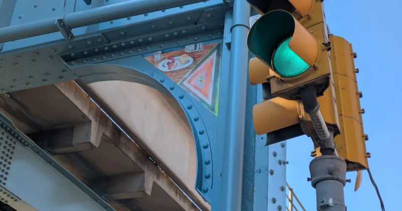 Notice the hundreds of new triangular paintings under the El in Kensington? Here's why they're there