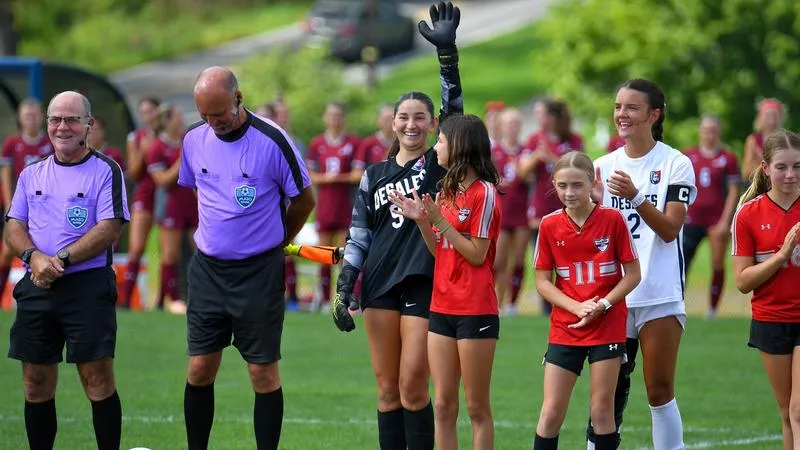 Women's Soccer Spreads Awareness For Domestic Violence and Teen Dating Violence in Morgan's Light Game