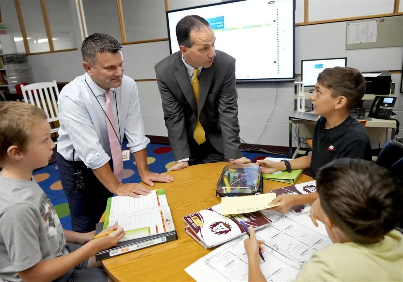 Two small school districts. One very busy boss.