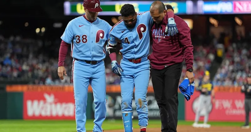Luis Arraez sprains ankle in Phillies' loss to Brewers, who reach 100 wins for 1st time in franchise history