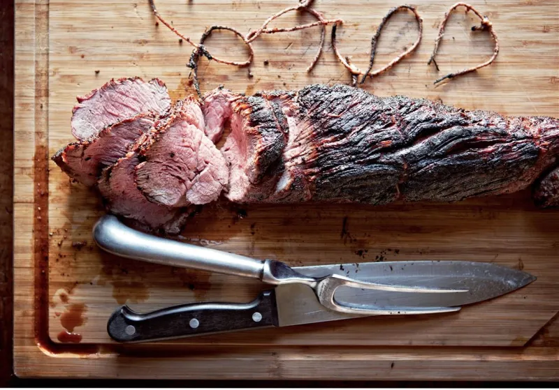 Smoky, fire-kissed beef tenderloin with herb butter comes from Canal House