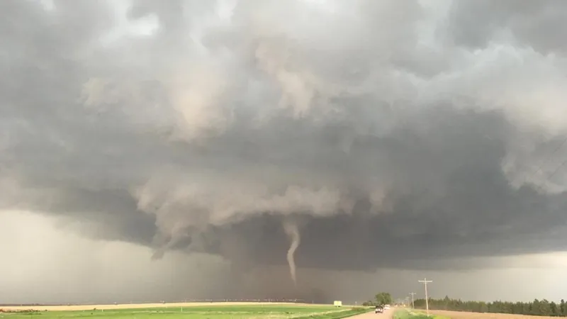 How does atmospheric turbulence impact tornado formation?