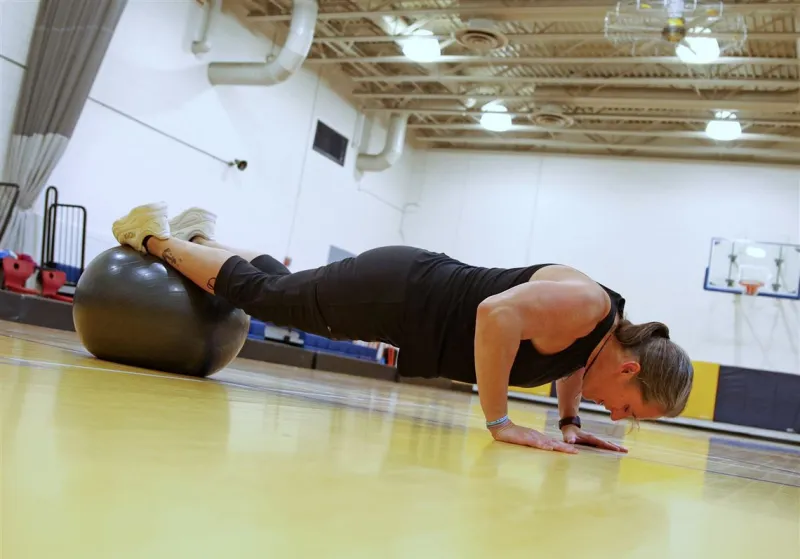 At 54, a Falk School teacher breaks Guinness World Record for pushups in an hour