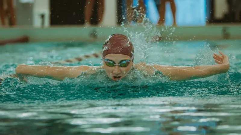 MacAlister's victory in the butterfly leads the way for Women's Swimming at ESU