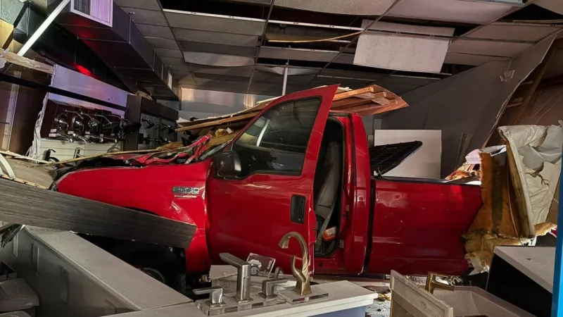 Driver injured after truck crashes through building in Cumberland County