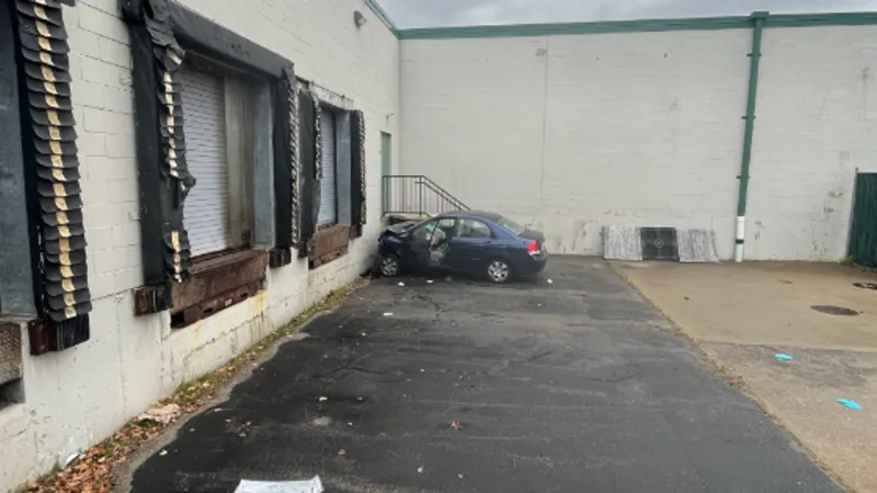 Crews respond after vehicle smashes into the side of building