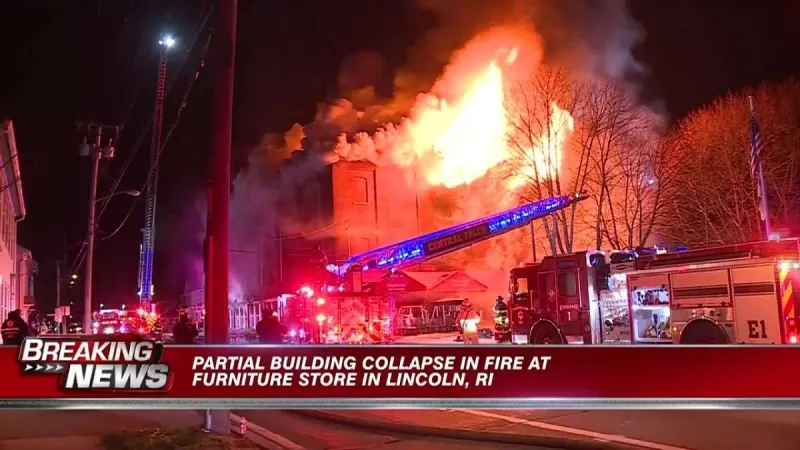 Part of a furniture store collapses from fire in Lincoln, RI