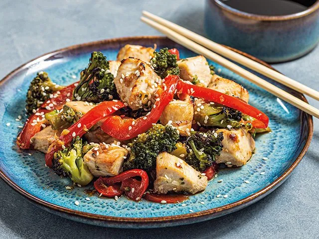 Sesame chicken with broccoli and red peppers