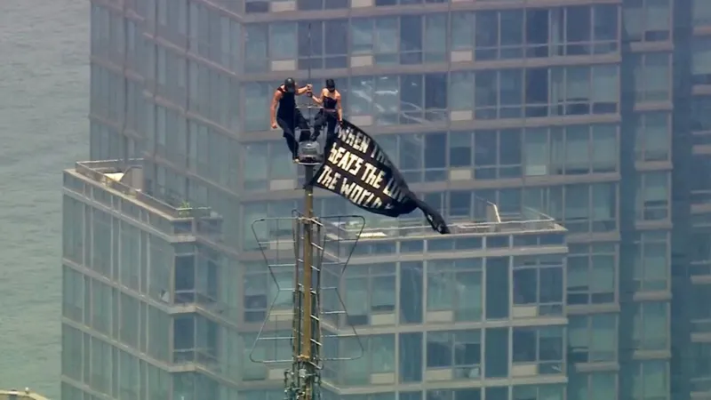 MORNING BUZZ: Couple scales Empire State Building, unfurls peace banner and gets engaged