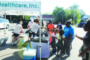 Genesis and partners give food boxes, school supplies