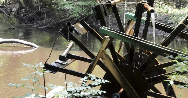 Water wheel continues its rhythmic cycle