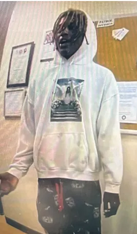 Police: One charged another sought in school bus stop shooting