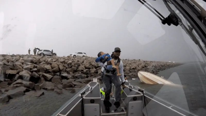 Deputy wades into stormy water to rescue child, 2 adults after boat capsizes
