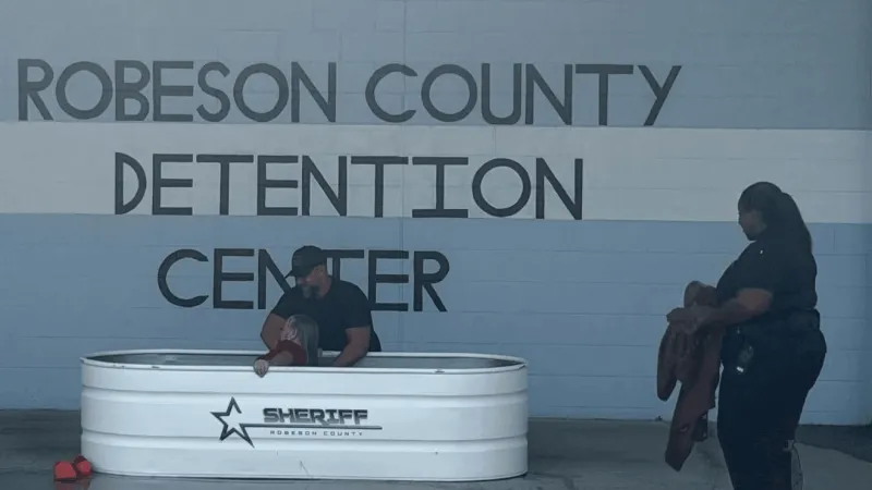 27 inmates baptized during service at Robeson Co. Detention Center