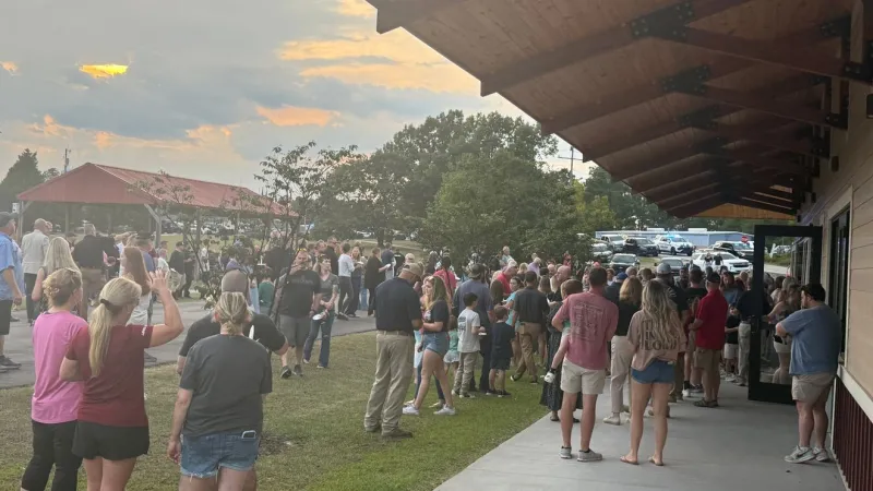 Grief and prayers fill Elgin as community holds vigil for Officer Christopher DeLong