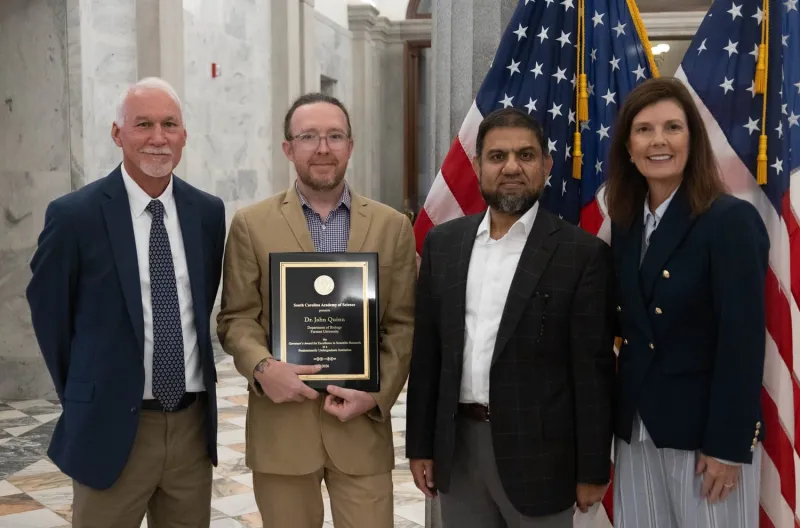 Quinn receives Governor's Award for Excellence in Science